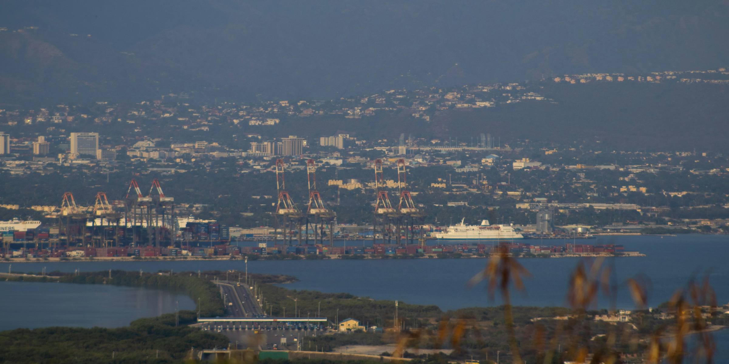 Kingston Harbour and its port seen across the mangroves at Portmore